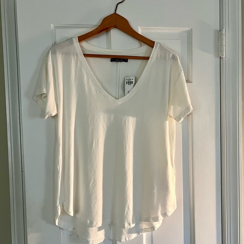 Cream colored Abercrombie tee.